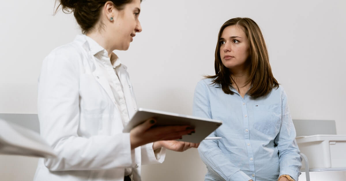 woman consulting with GYNECOLOGIST